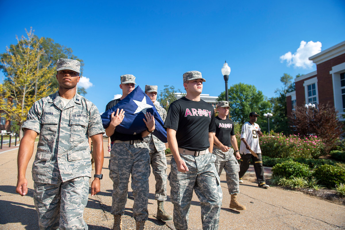 ROTC Cadets escorting the flag to Davis Wade Stadium