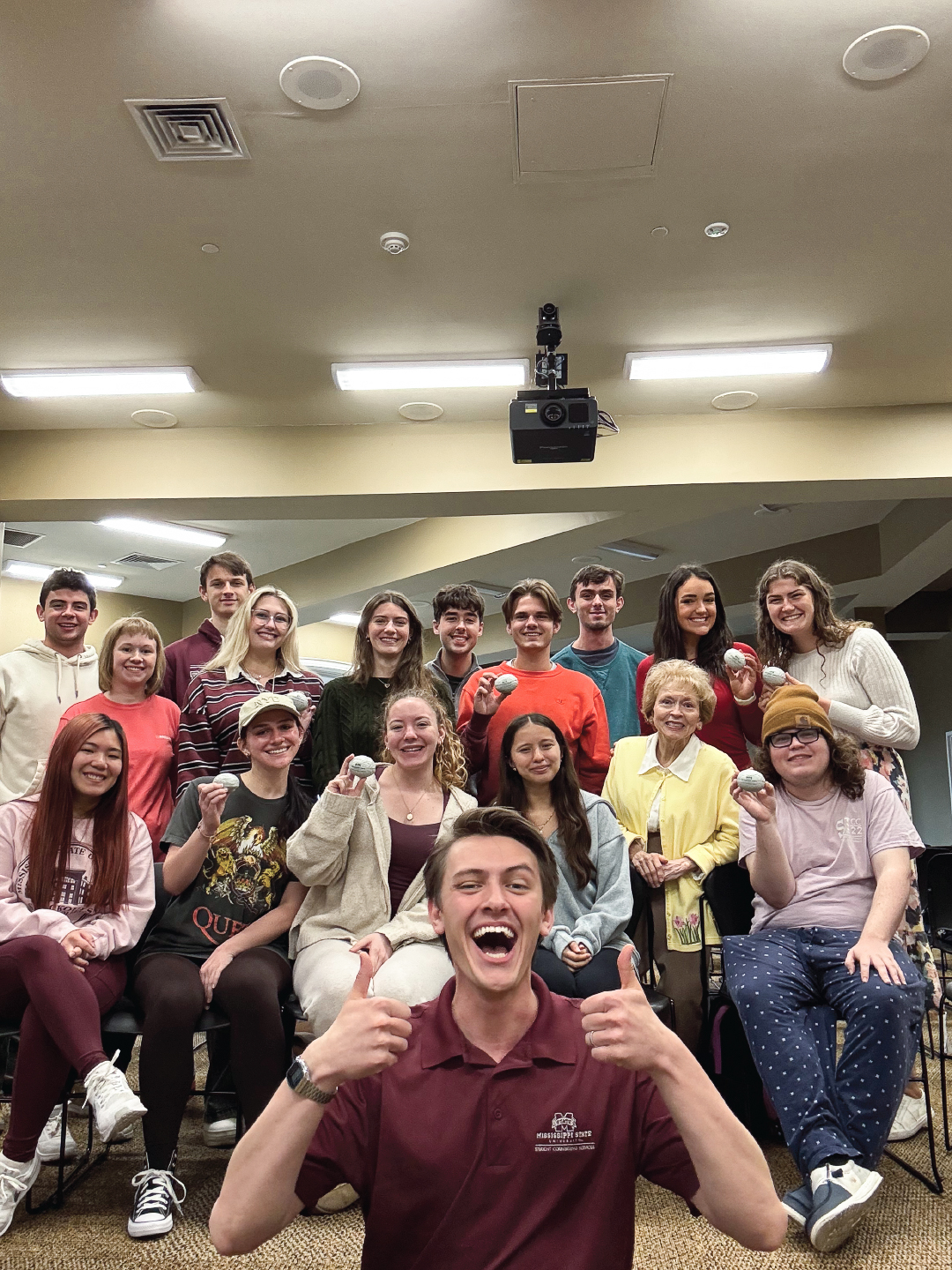 Matt Freeman poses with students at an event